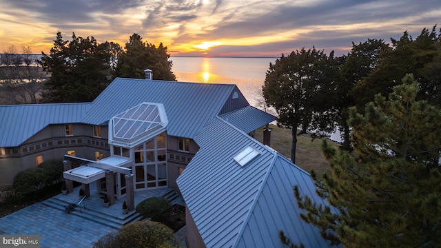 exterior space with a water view