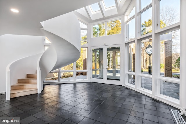 interior space featuring french doors and plenty of natural light