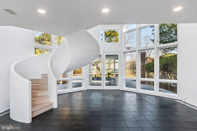 interior space with plenty of natural light and floor to ceiling windows