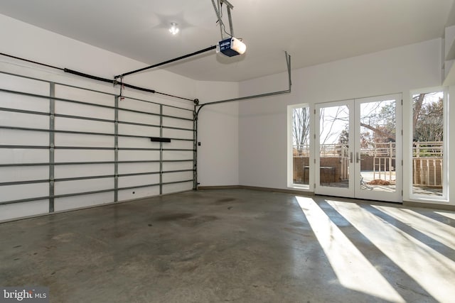 garage featuring a garage door opener and french doors