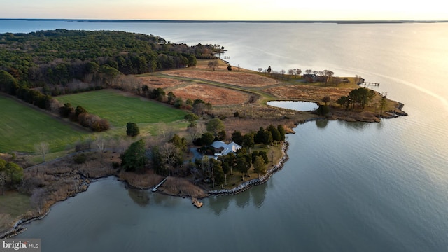 aerial view at dusk with a water view