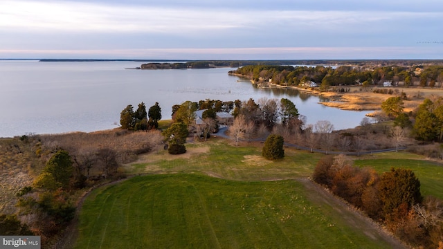 aerial view at dusk with a water view