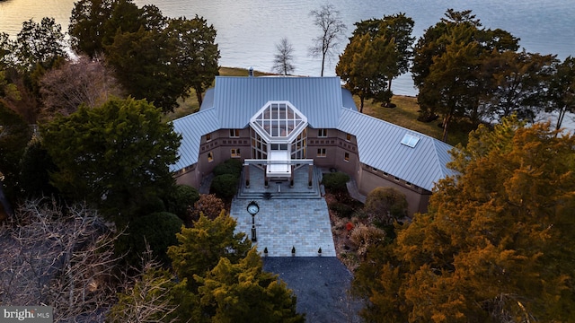 birds eye view of property with a water view