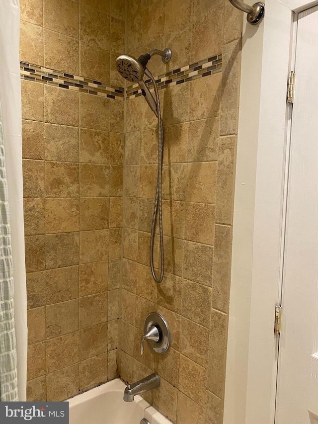 interior details with shower / bath combination with curtain