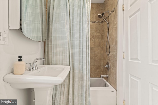 bathroom with sink and shower / bath combo