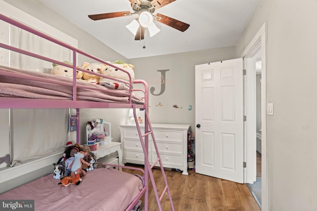 bedroom with ceiling fan and wood-type flooring