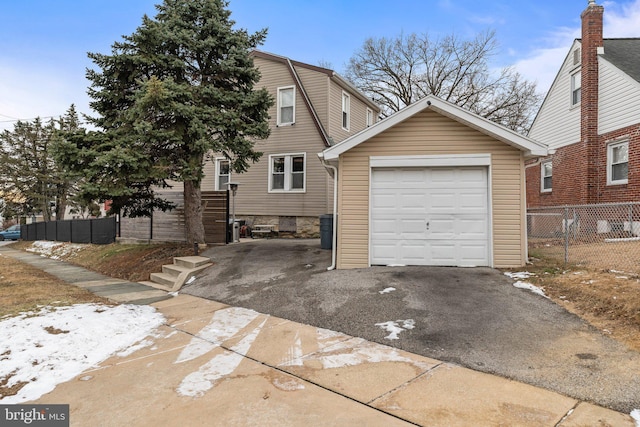 view of front of property featuring an outbuilding and a garage