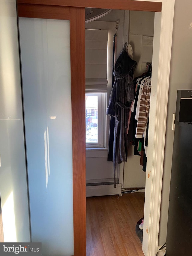 closet featuring a baseboard radiator