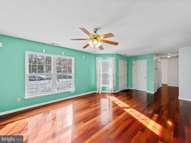 unfurnished living room with ceiling fan and wood-type flooring