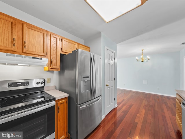 kitchen featuring hanging light fixtures, dark wood-type flooring, appliances with stainless steel finishes, and a chandelier