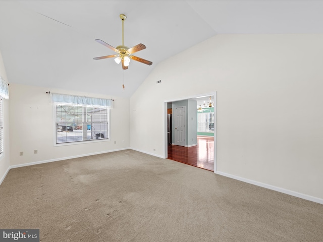 carpeted empty room featuring ceiling fan and high vaulted ceiling