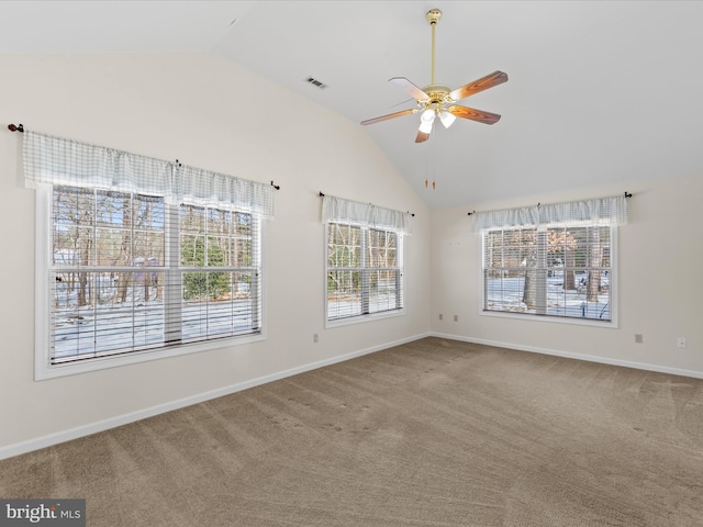 carpeted empty room featuring ceiling fan and high vaulted ceiling