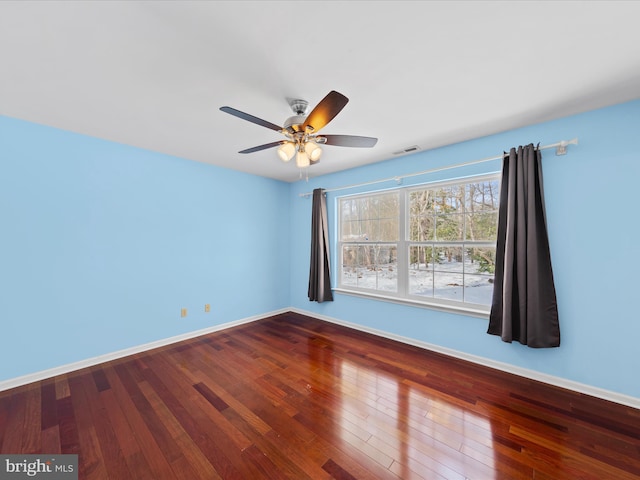 spare room featuring hardwood / wood-style flooring and ceiling fan