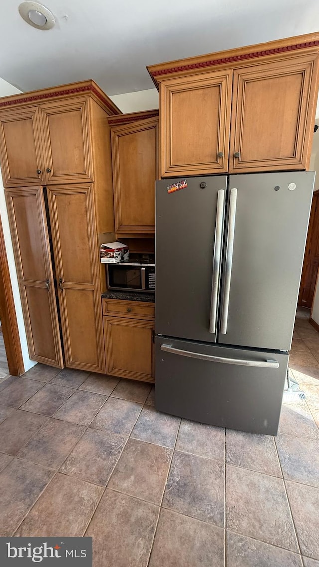 kitchen featuring stainless steel refrigerator