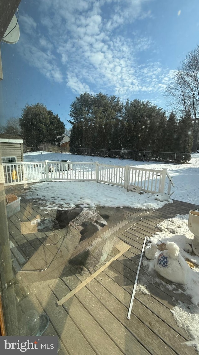 view of swimming pool with a wooden deck