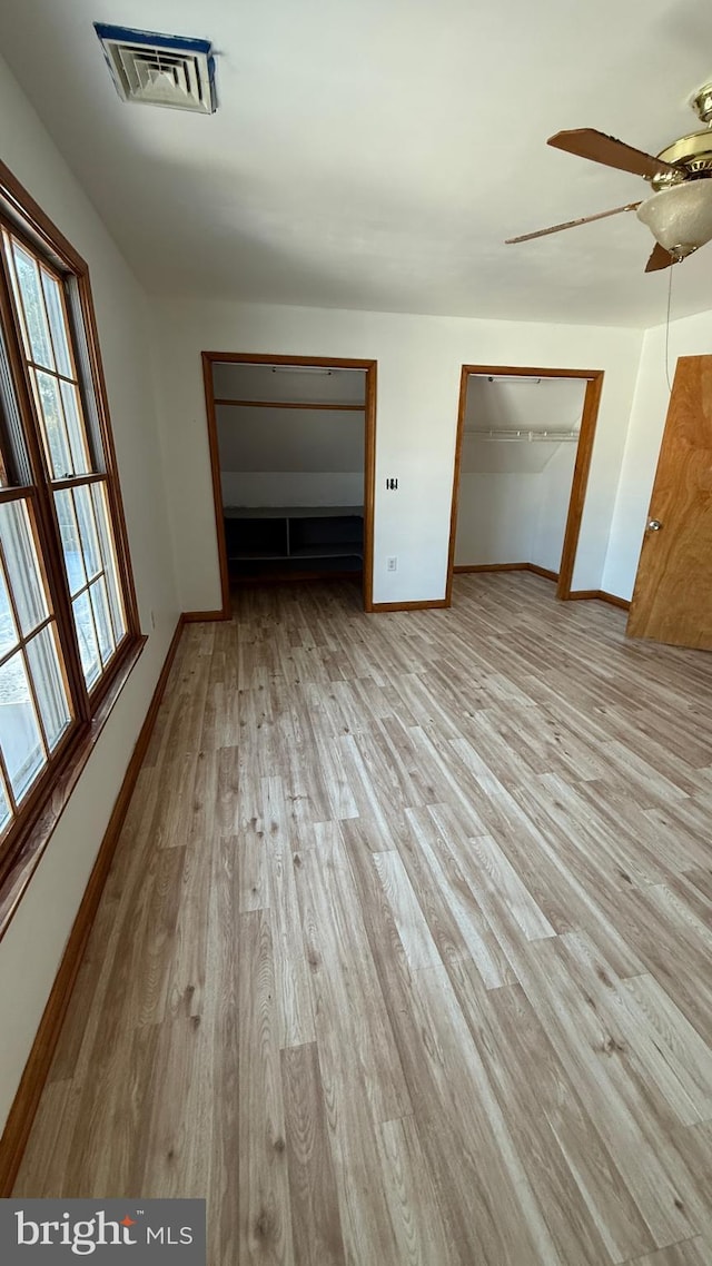 unfurnished bedroom with a closet, ceiling fan, and light hardwood / wood-style floors