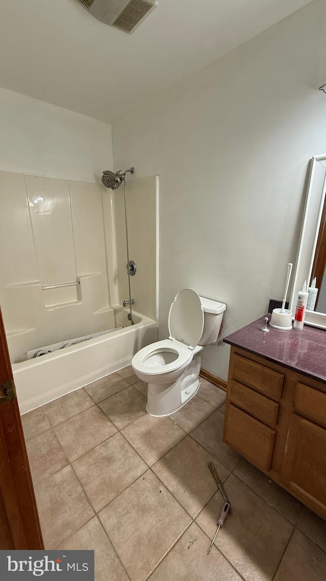 full bathroom with toilet, vanity, tile patterned floors, and bathtub / shower combination