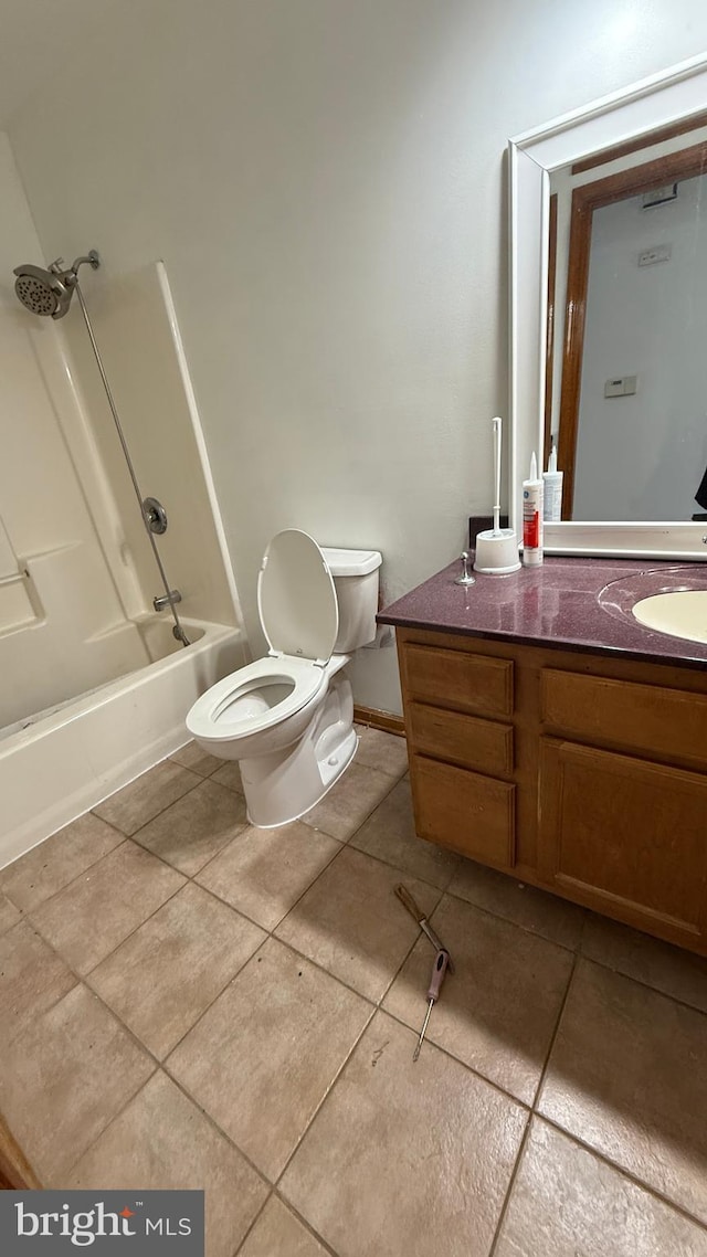 full bathroom featuring tile patterned floors, bathtub / shower combination, vanity, and toilet