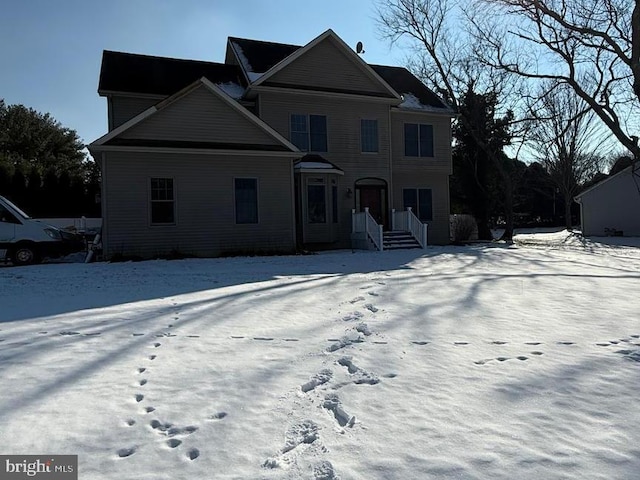 view of snow covered property