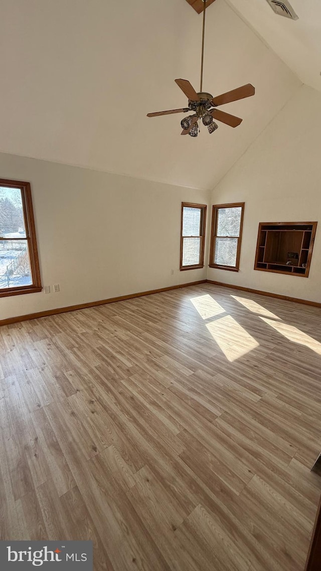 unfurnished room featuring high vaulted ceiling, ceiling fan, and light hardwood / wood-style floors