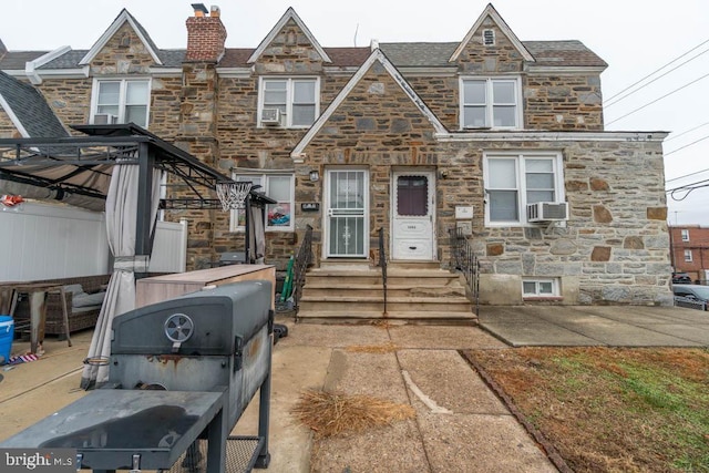 view of front of home with cooling unit