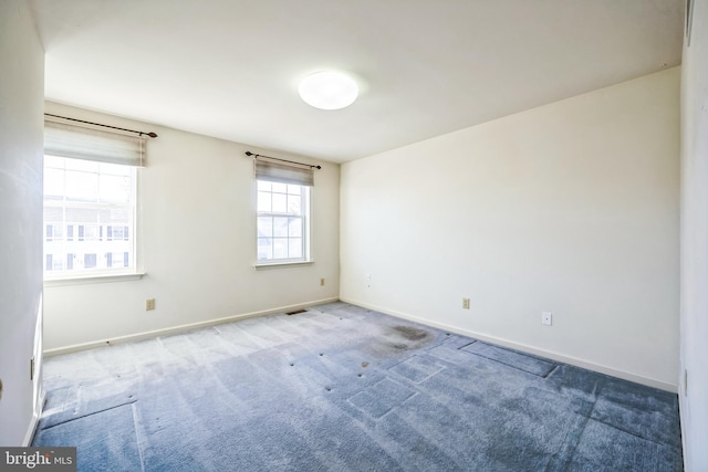 spare room featuring carpet flooring