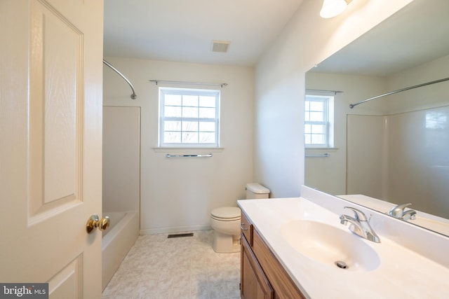 full bathroom with vanity, bathtub / shower combination, and toilet