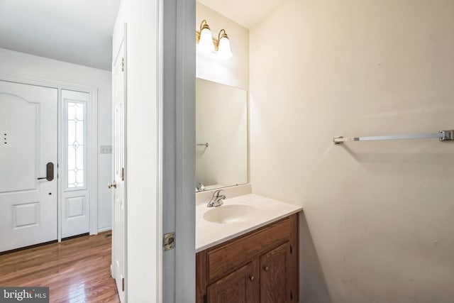 bathroom with vanity and hardwood / wood-style flooring