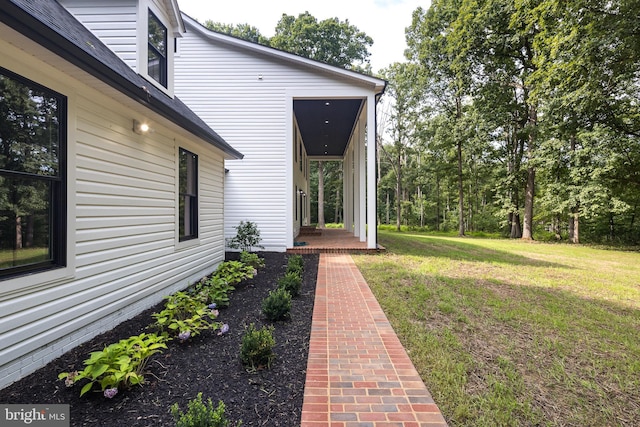 doorway to property featuring a yard