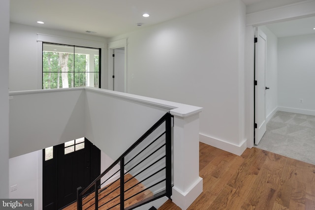 hall with light hardwood / wood-style flooring