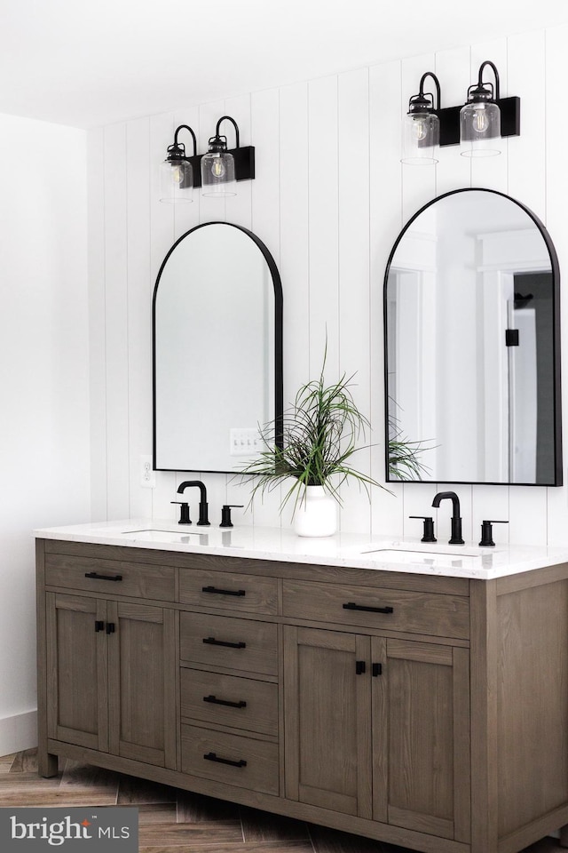 bathroom with vanity and wood-type flooring