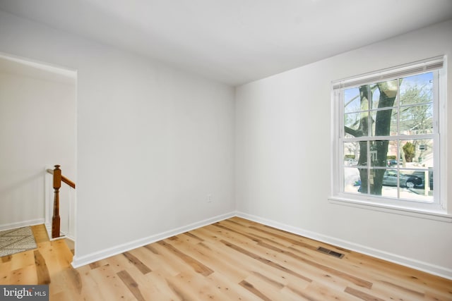 empty room featuring hardwood / wood-style flooring