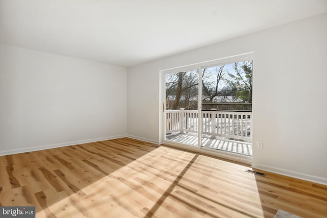 empty room featuring hardwood / wood-style flooring