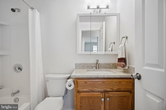 full bathroom with vanity, shower / tub combo, and toilet