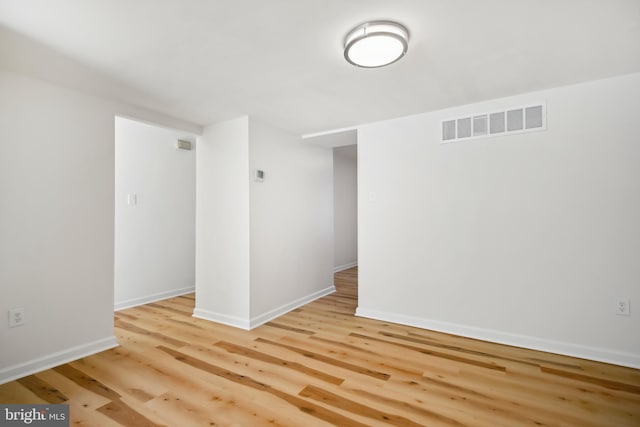 spare room with light hardwood / wood-style flooring