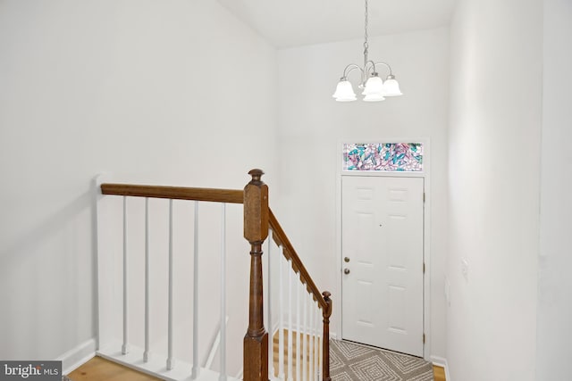 entrance foyer featuring a notable chandelier