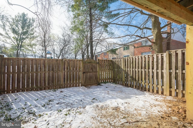 view of yard covered in snow