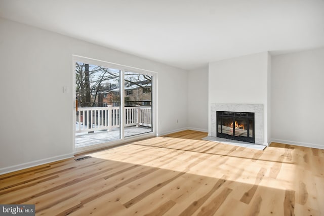 unfurnished living room featuring wood-type flooring