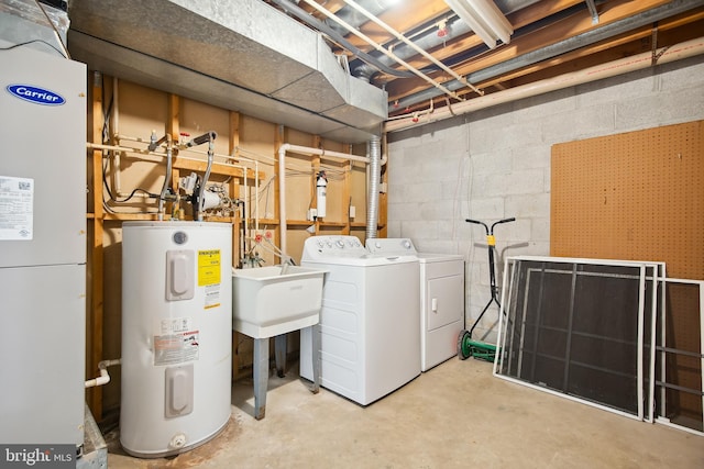 washroom featuring washer and dryer and water heater