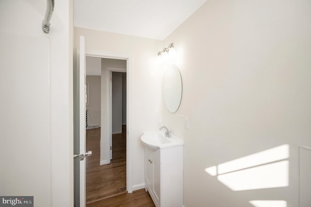 bathroom featuring vanity and hardwood / wood-style floors