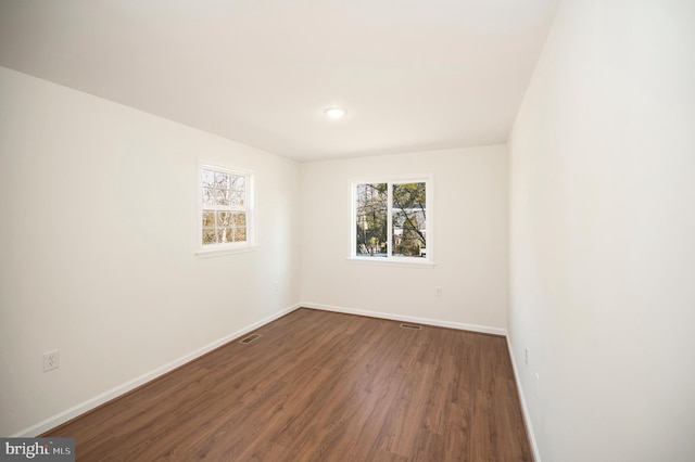 empty room featuring dark hardwood / wood-style floors