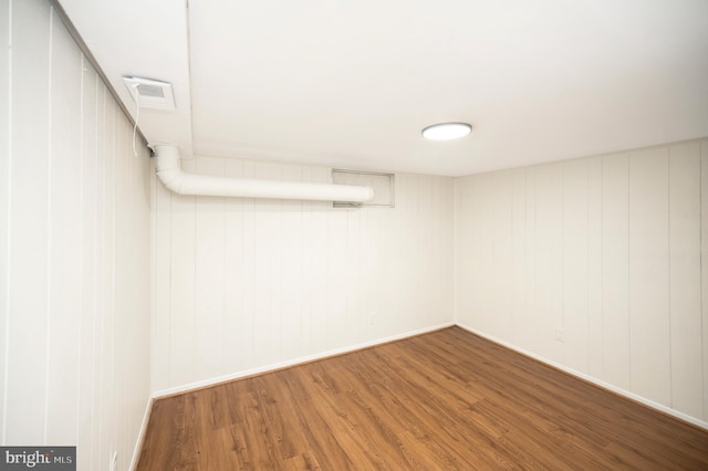 basement featuring hardwood / wood-style flooring