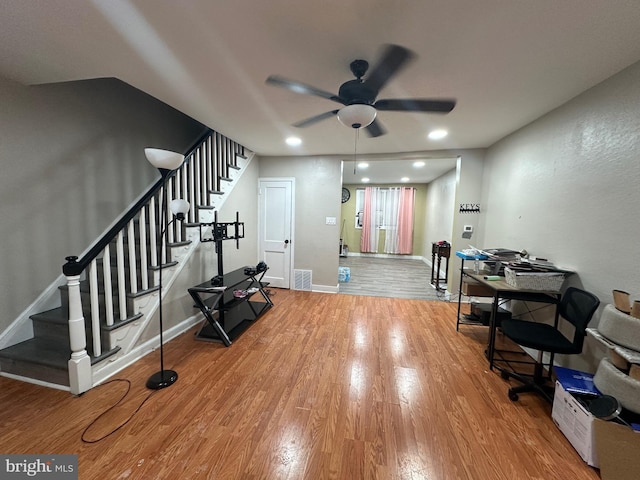 interior space featuring hardwood / wood-style floors and ceiling fan