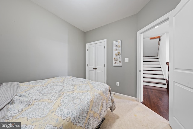 bedroom featuring a closet and carpet flooring