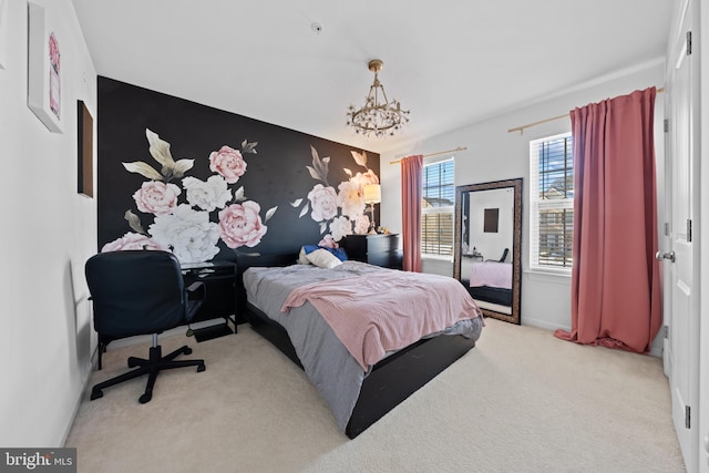 bedroom with an inviting chandelier and light colored carpet