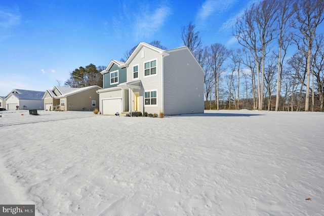 back of property featuring a garage