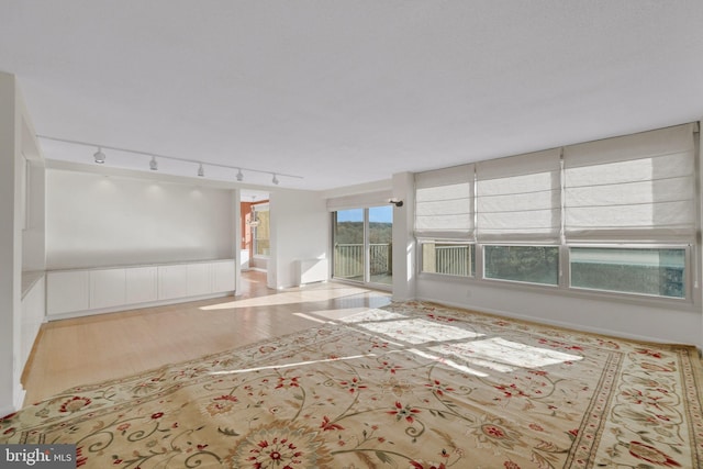 spare room featuring light hardwood / wood-style floors