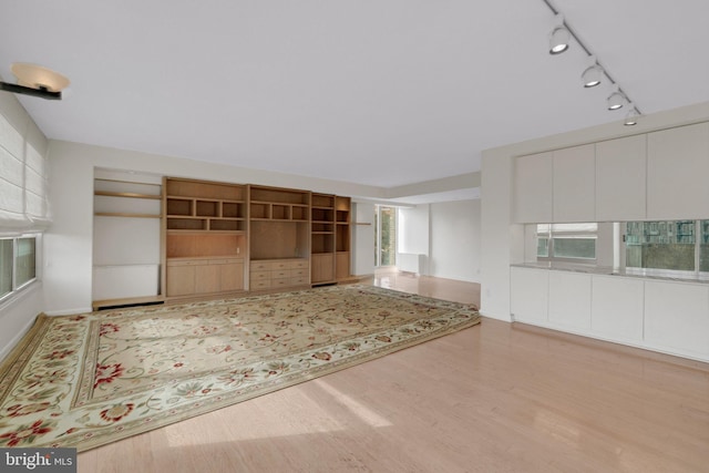 unfurnished living room with light wood-type flooring