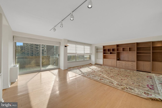 unfurnished living room with light hardwood / wood-style floors