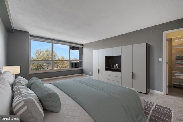 carpeted bedroom with a textured ceiling